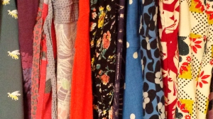 The array of bright colours of the dresses in my wardrobe.