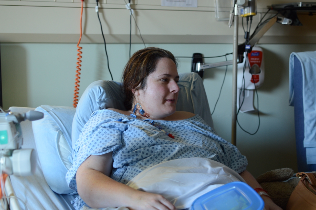 Me in Bedford Hospital. You can see the central line in my neck, and how big I was becoming (besides me being 24 weeks' pregnant).